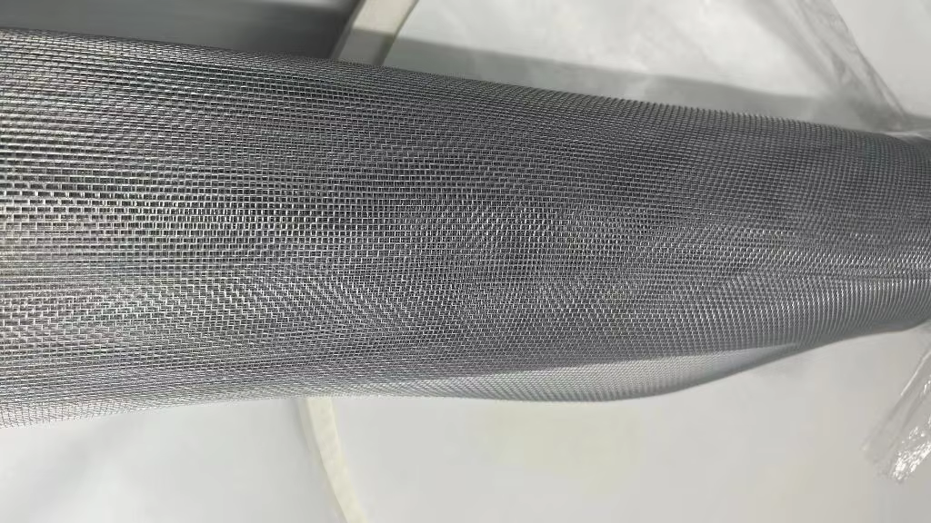 Close-up of finished screen mesh wound on a roll